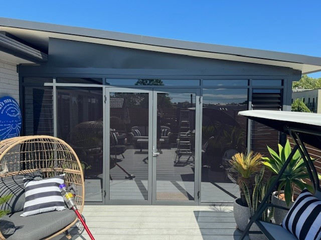 Custom made residential doors with louvre gallery.