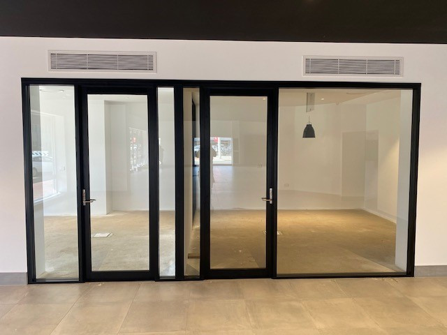 Custom made commercial showroom doors.